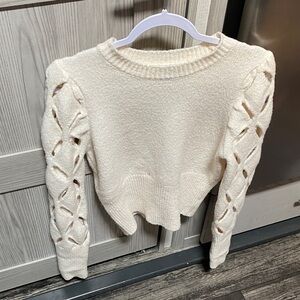 Elegant Cream Sweater with Braided Sleeves